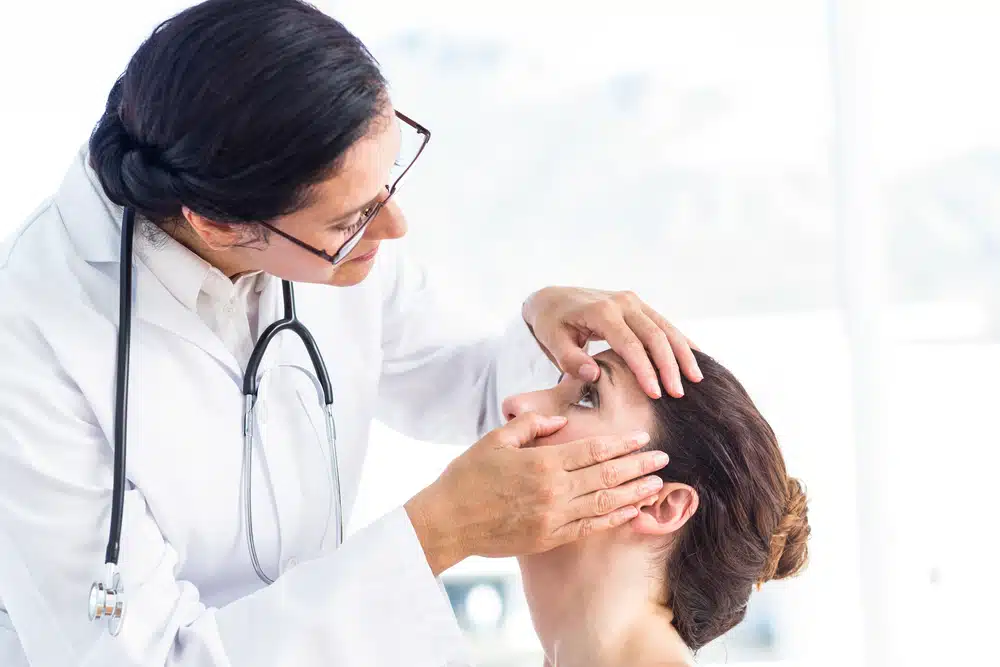 Professional eye care doctor examining patient comprehensive vision care